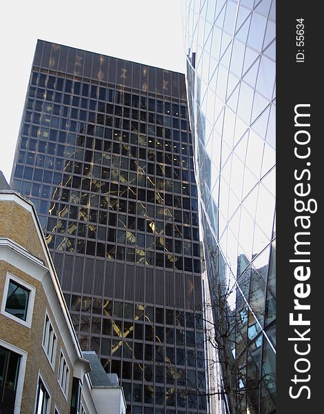 View of skyscraper with reflections of the Gerkin building oposite. View of skyscraper with reflections of the Gerkin building oposite