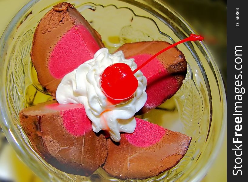 Chocolate and raspberry icecream with a cherry shallow dof. Chocolate and raspberry icecream with a cherry shallow dof