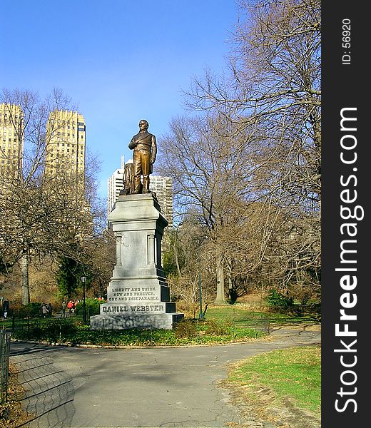 Tribute to Daniel Webster in Central Park of New York with skyscrapers in background. Tribute to Daniel Webster in Central Park of New York with skyscrapers in background