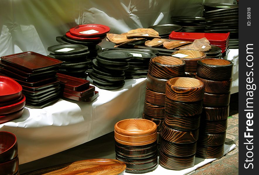 Different wooden kitchen things on a Japanese market stand. Different wooden kitchen things on a Japanese market stand