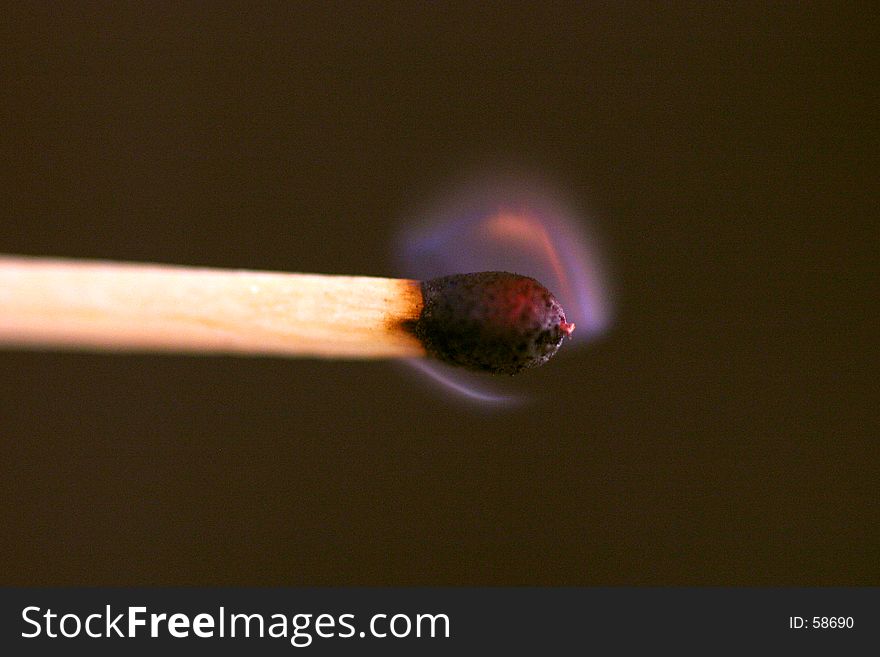A macro image of a match beeing lit. A macro image of a match beeing lit