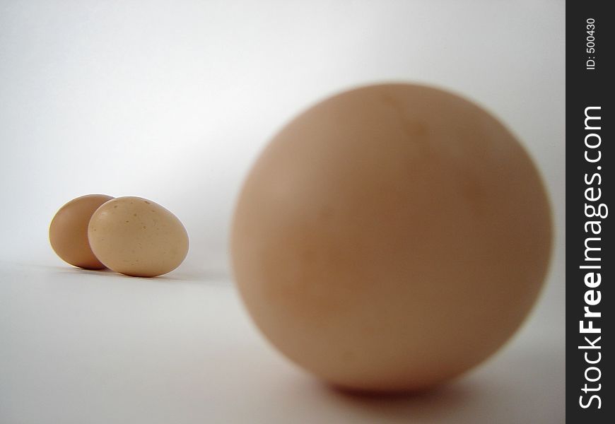 Isolated eggs, focus on the too eggs in the background.