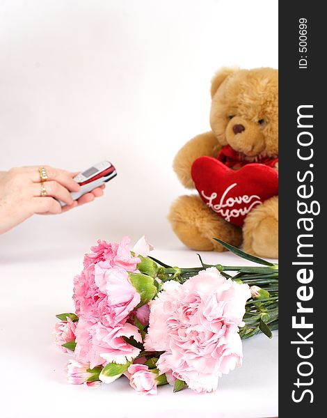 Womans hands dialling phone with gifts to the side. Ideal for valentines day or anniversaries, dating etc. Womans hands dialling phone with gifts to the side. Ideal for valentines day or anniversaries, dating etc