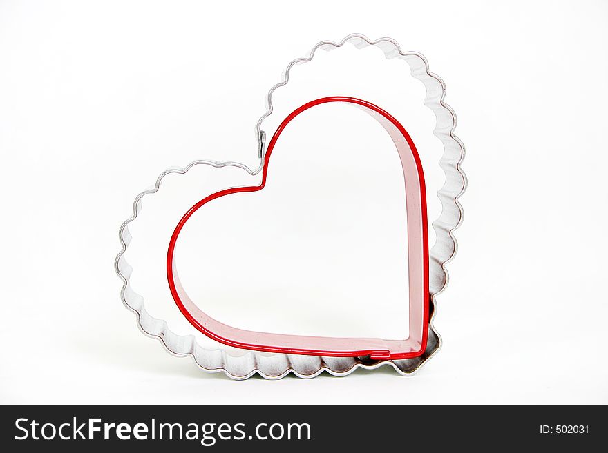 Cooking cutter hearts with white background.