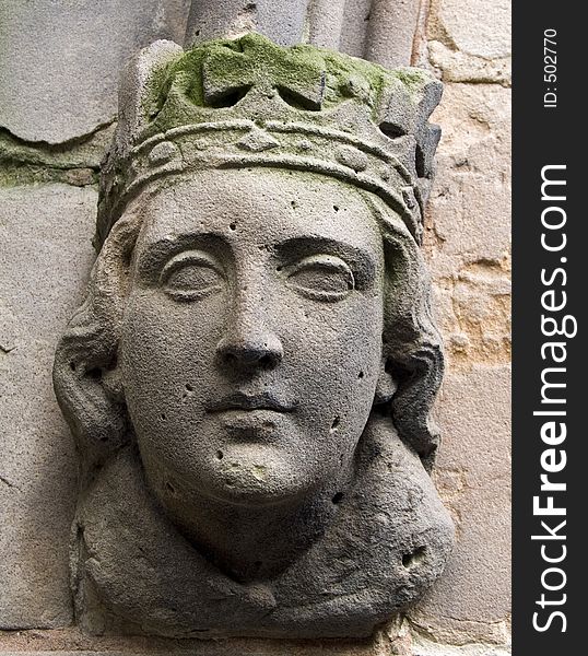 Carved head on ancient church in Birmingham, England. Carved head on ancient church in Birmingham, England