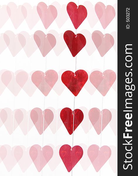 Red hearts lined in rows with white background
