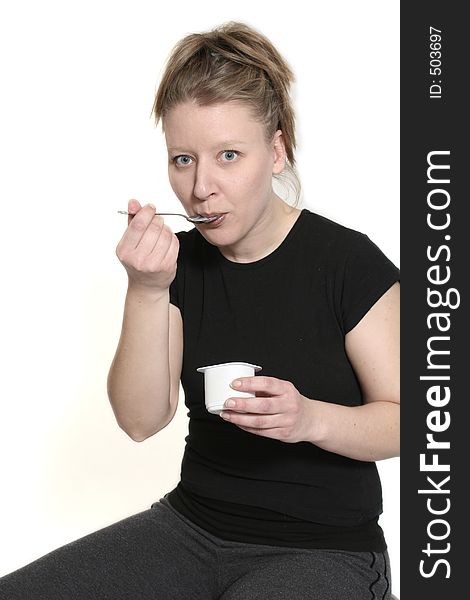 Woman eating yogurt