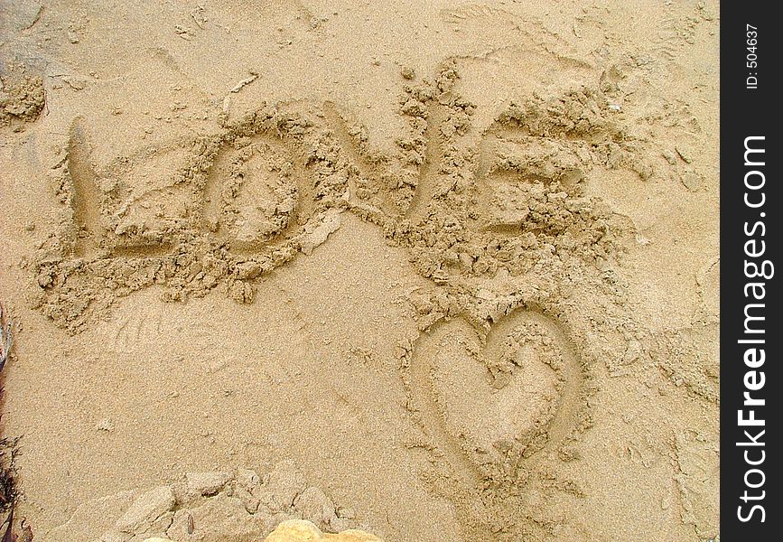 Love heart in sand