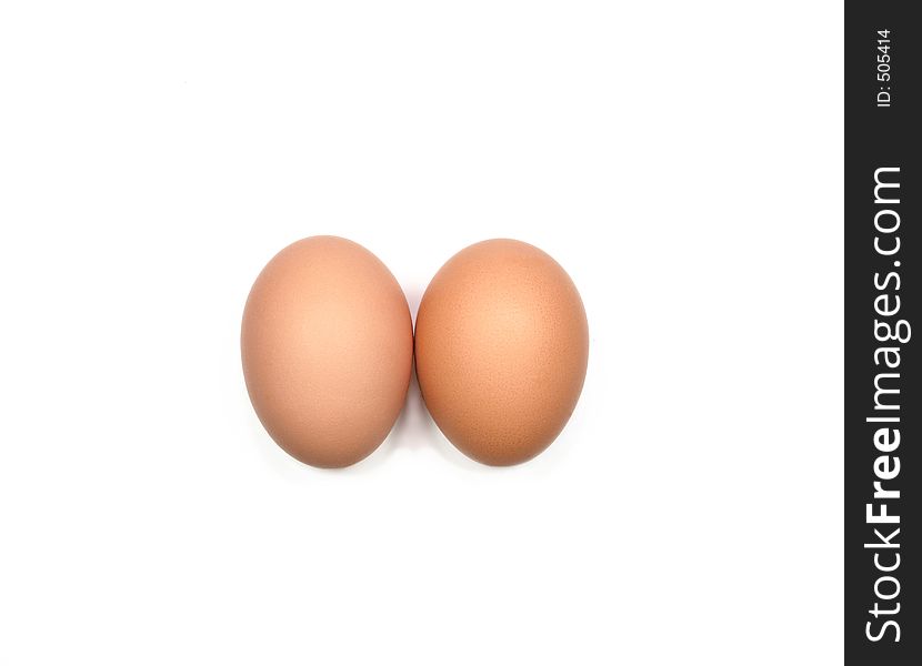 Two eggs next to each other against a white background. Two eggs next to each other against a white background.