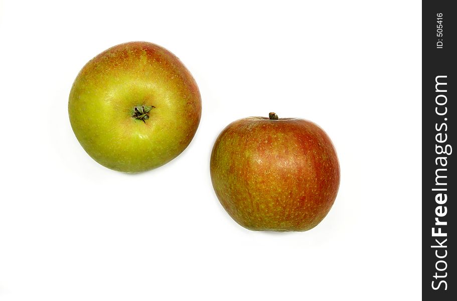 Two ripe cox apples on a white background. Two ripe cox apples on a white background.