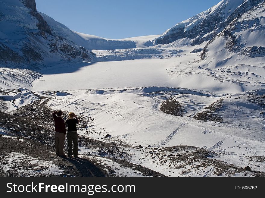 Tourists view the vast Columbia Icefields in Jasper National Park. Tourists view the vast Columbia Icefields in Jasper National Park.