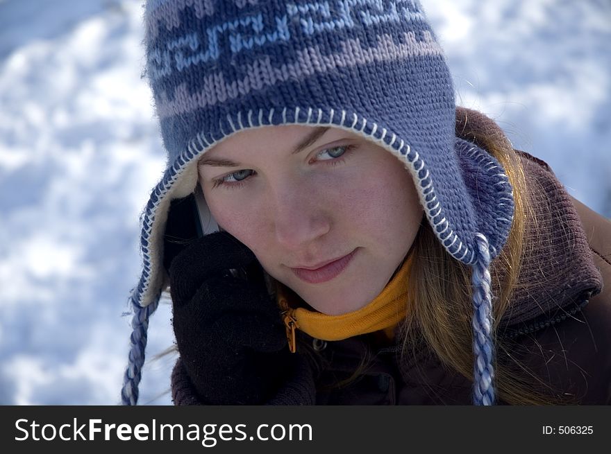 Portrait of a young girl talking on the phone