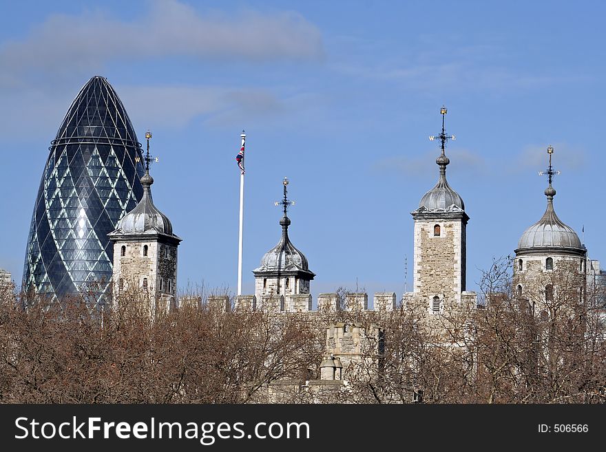 The ultra-modern 'Gherkin' looms behind the Tower of Lodon. The ultra-modern 'Gherkin' looms behind the Tower of Lodon
