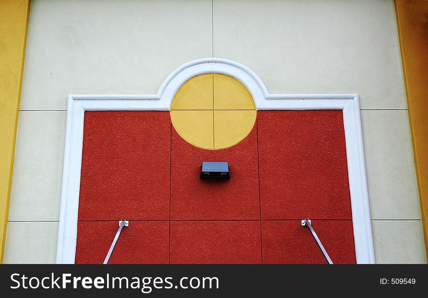 Colorful architectural details of wall of modern building, yellow,burnt sienna,white, cream,gold. Colorful architectural details of wall of modern building, yellow,burnt sienna,white, cream,gold