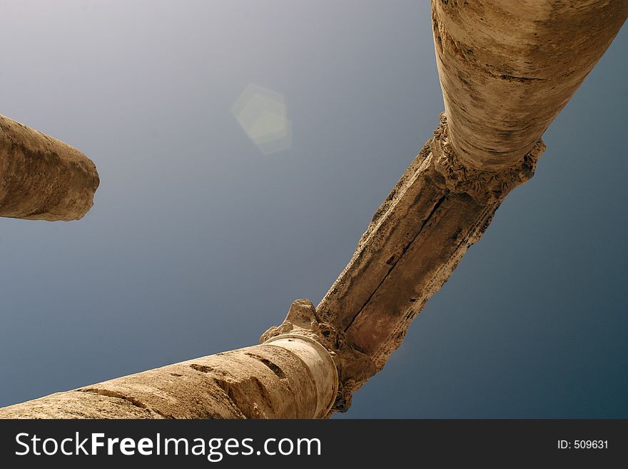 Ancient roman columns against a blue sky. Ancient roman columns against a blue sky