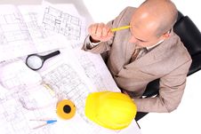 Businessman Thinking With Architectural Plans Royalty Free Stock Image
