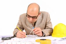Businessman With Architectural Plans Royalty Free Stock Photography