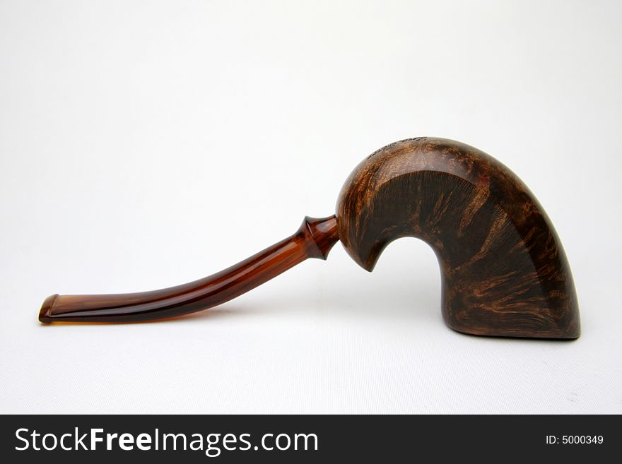 An tobacco pipe on white background. An tobacco pipe on white background.