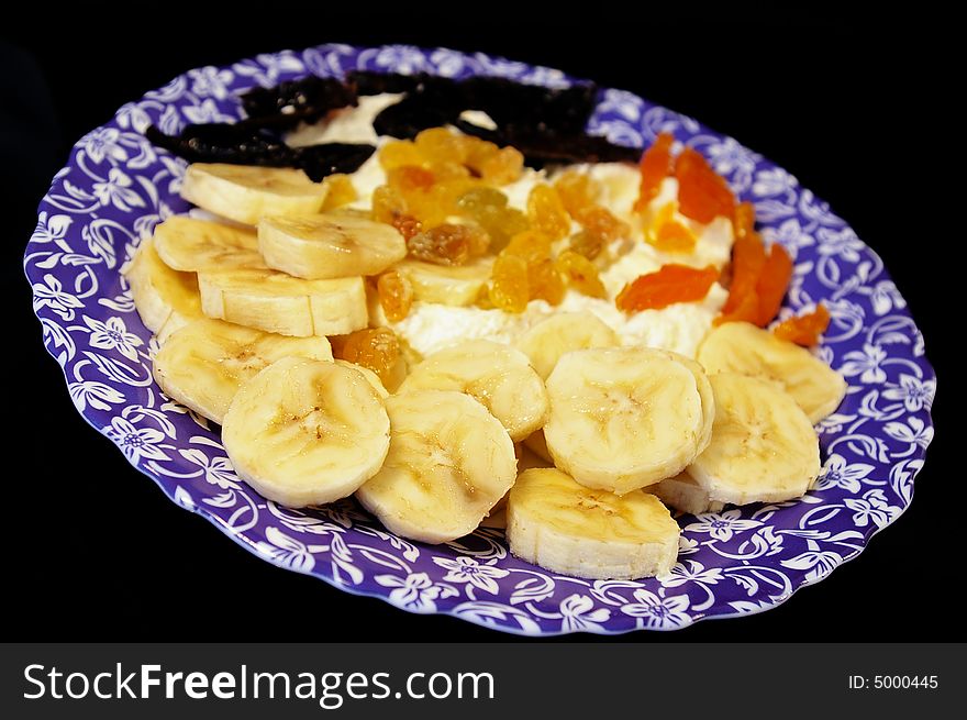 Cottage cheese with banana, dried apricots, raisin and prunes. Cottage cheese with banana, dried apricots, raisin and prunes