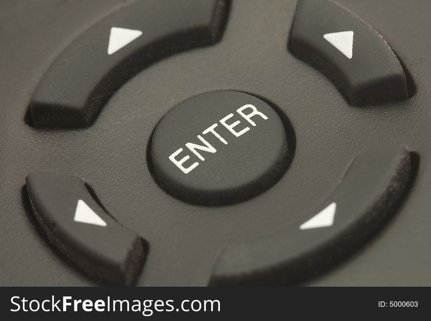 Black remote control, ENTER button in the middle, direction buttons on sides. Black remote control, ENTER button in the middle, direction buttons on sides