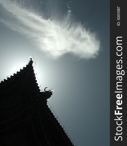 After a summer rain, a cloud floats over the ancient building of Qianmen town of Beijing, China. After a summer rain, a cloud floats over the ancient building of Qianmen town of Beijing, China.