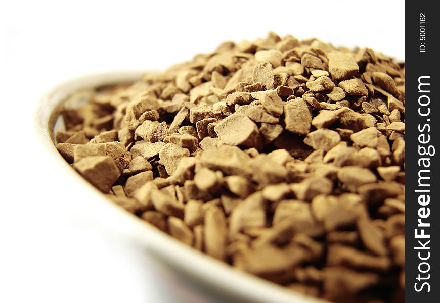 Instant coffee brown granules closeup. Instant coffee brown granules closeup