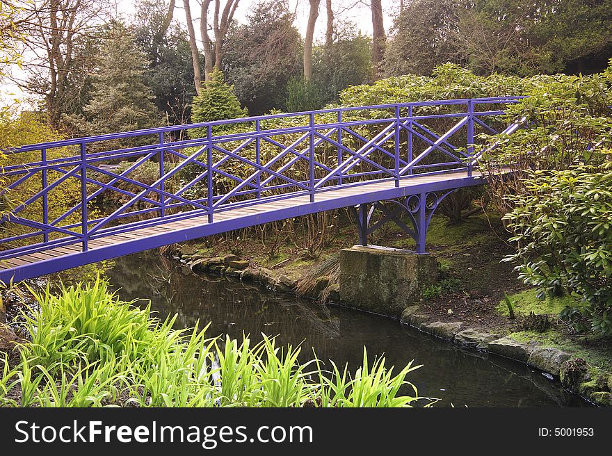 Blue Bridge crossing pond in Spring park