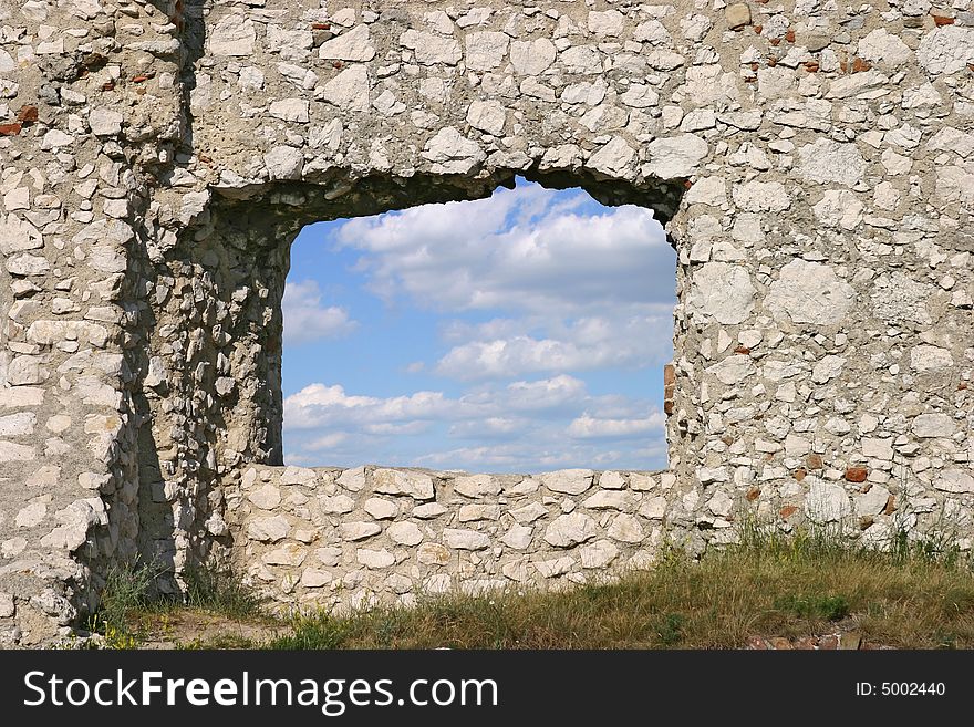 View at sky and clouds through a window of a ruin. View at sky and clouds through a window of a ruin