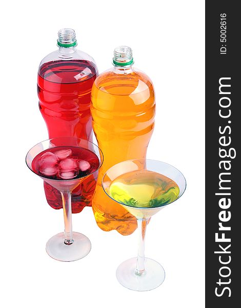 Bottles with color drinks on a white background