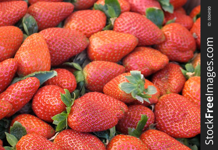 Garden fresh red strawberries at the market. Garden fresh red strawberries at the market