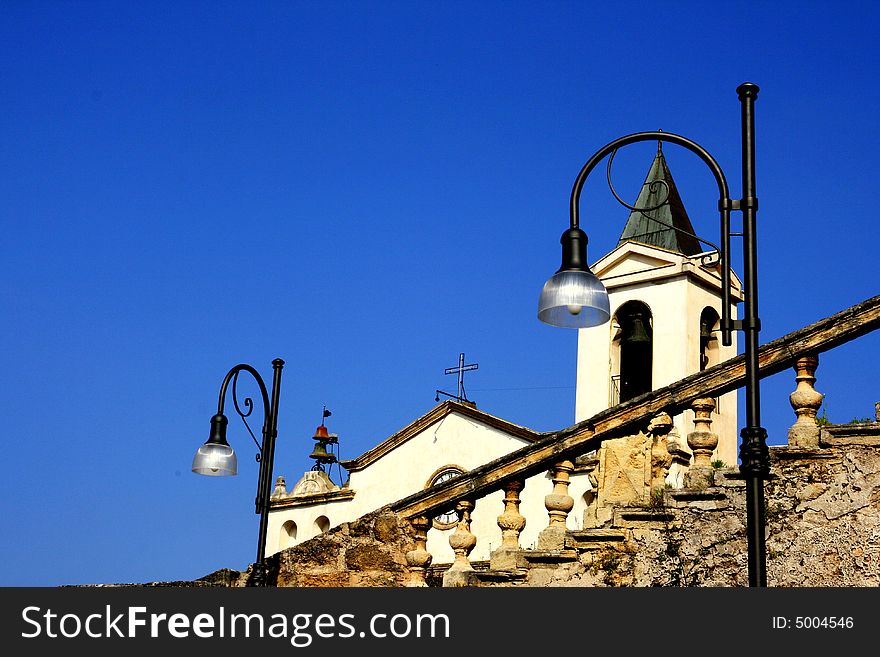 Church bell tower on blue sky