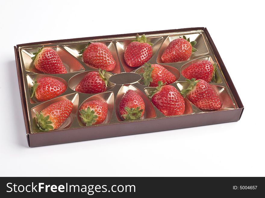 Strawberry in a box on a white