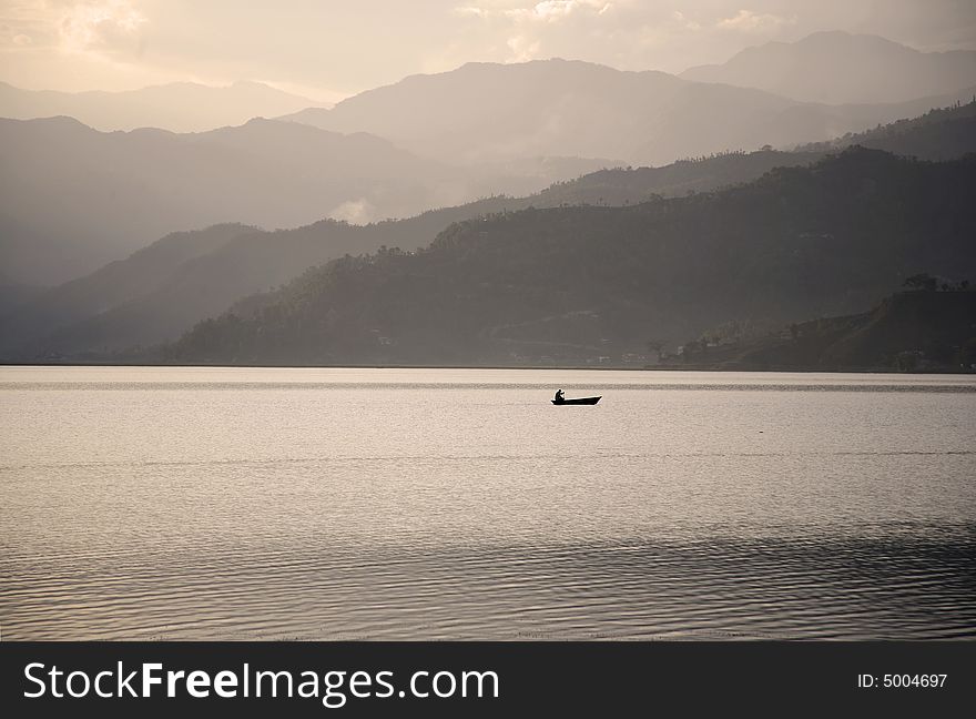 Boat on fewa lake at sunset, pokhara, nepal