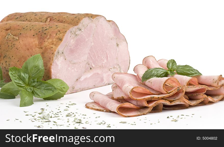 Ham and slices of ham with basil. Ham and slices of ham with basil