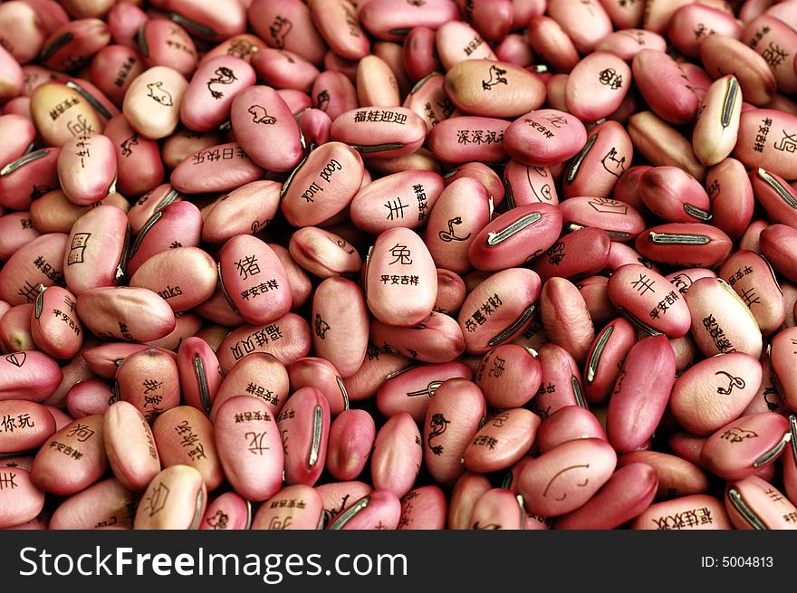 Bean seeds with lucky character and animal sign branded on it