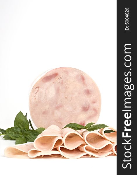 Ham and slices of ham with basil. Ham and slices of ham with basil