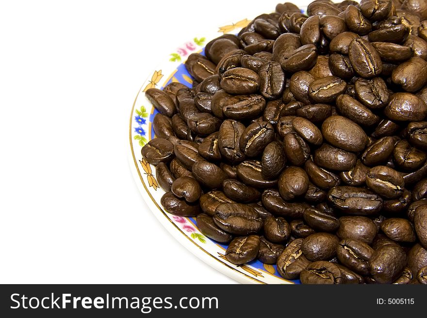 Coffe beans with plate isolated on white background