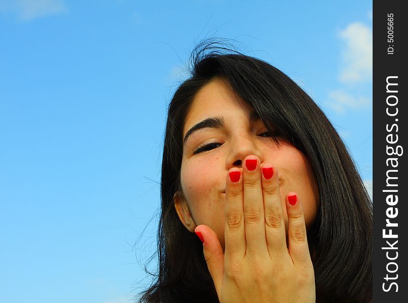 Woman Blowing A Kiss