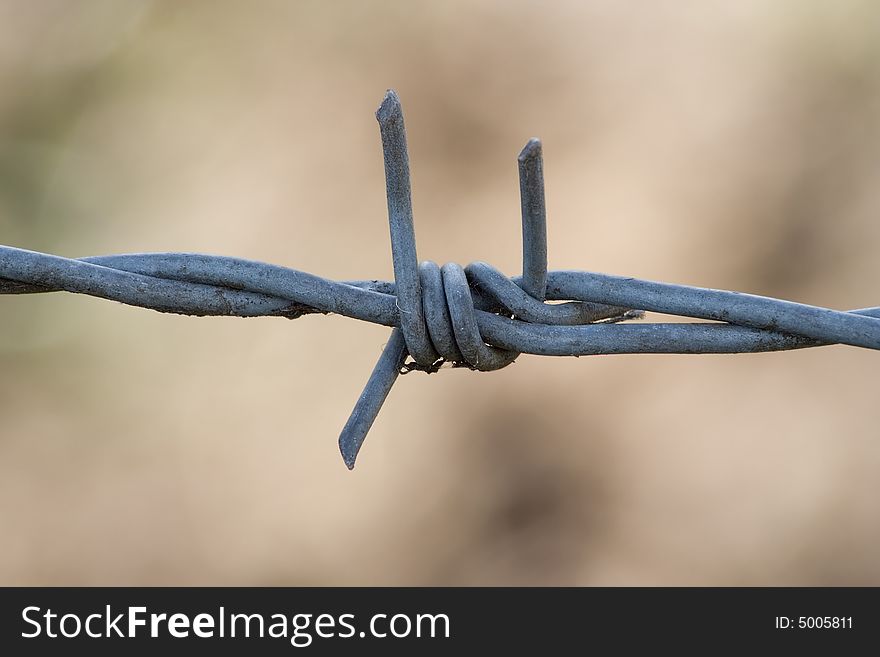 A dangerous Barbed wire fence.