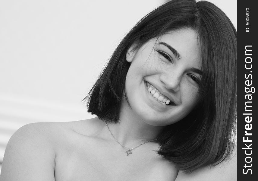 Headshot of a cute young woman smiling.