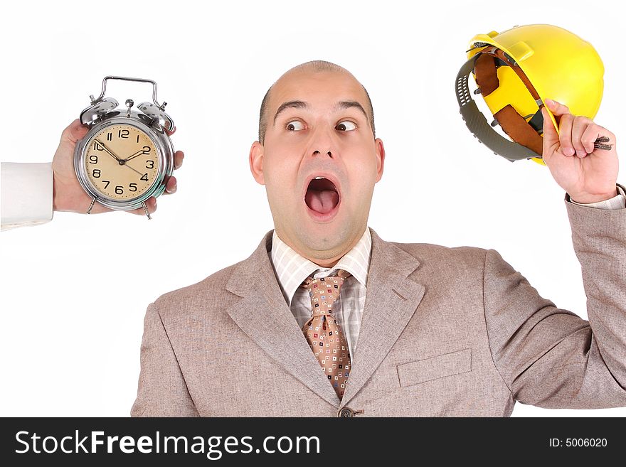 Confused a businessman looking at clock alarm
