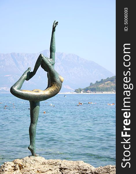 A bronze statue of a dancer in Budva, Montenegro. A bronze statue of a dancer in Budva, Montenegro.