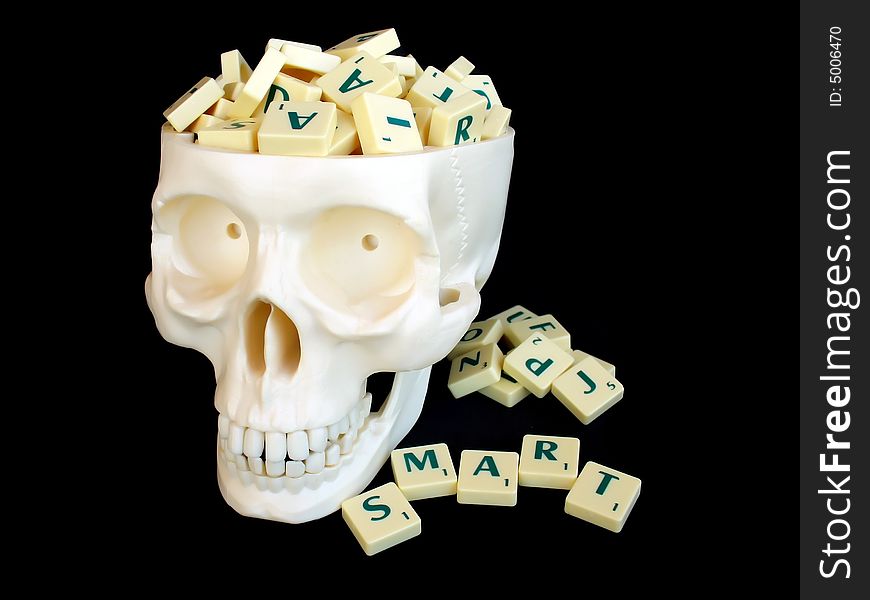 Skull with puzzle-letters inside head. Skull with puzzle-letters inside head