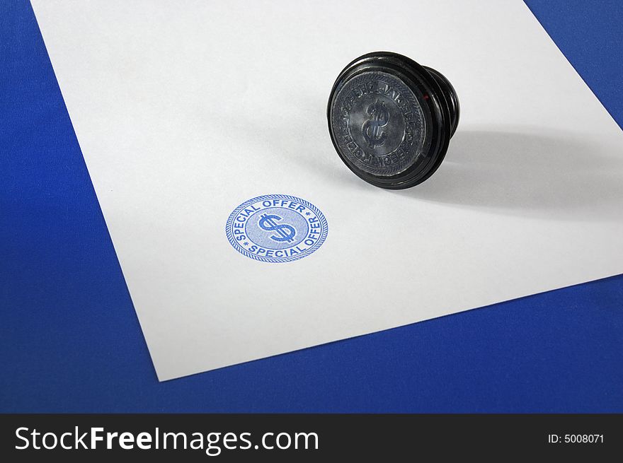 Stamp (special offer) on a blank page on a dark blue background