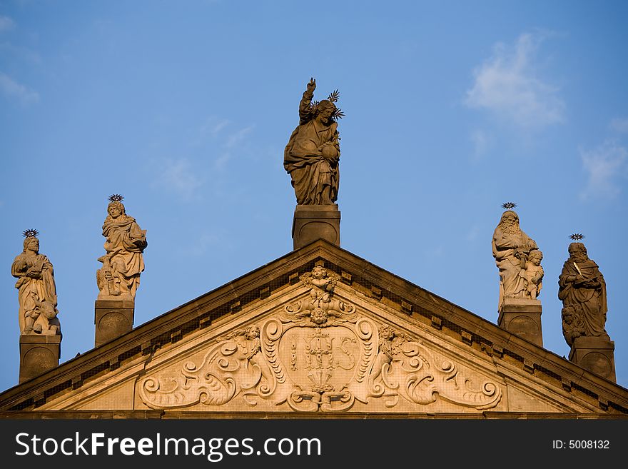 Roof of the church in Prague with five St. statues. Roof of the church in Prague with five St. statues.