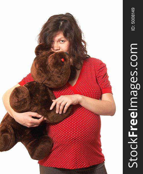 Portrait of the pregnant woman with the teddy bear