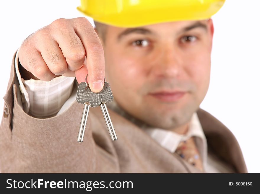 A businessman with keys on white background