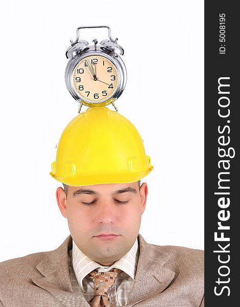 Sleepy businessman with clock alarm on his head