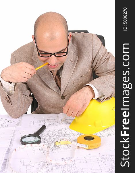 Businessman thinking with architectural plans