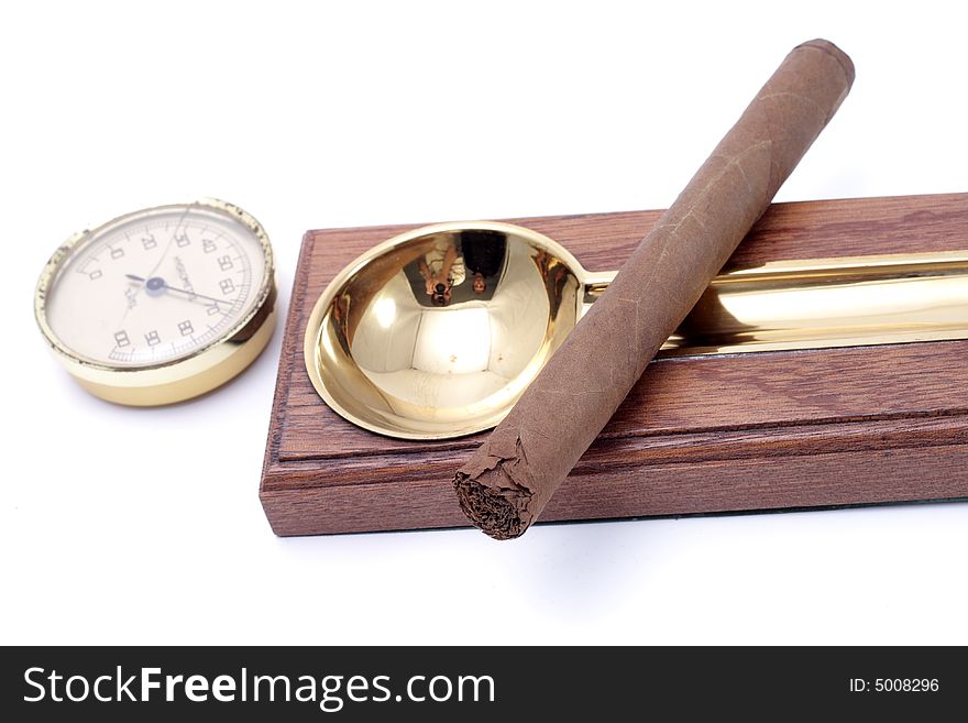 Cigar and ashtray isolated on a white background